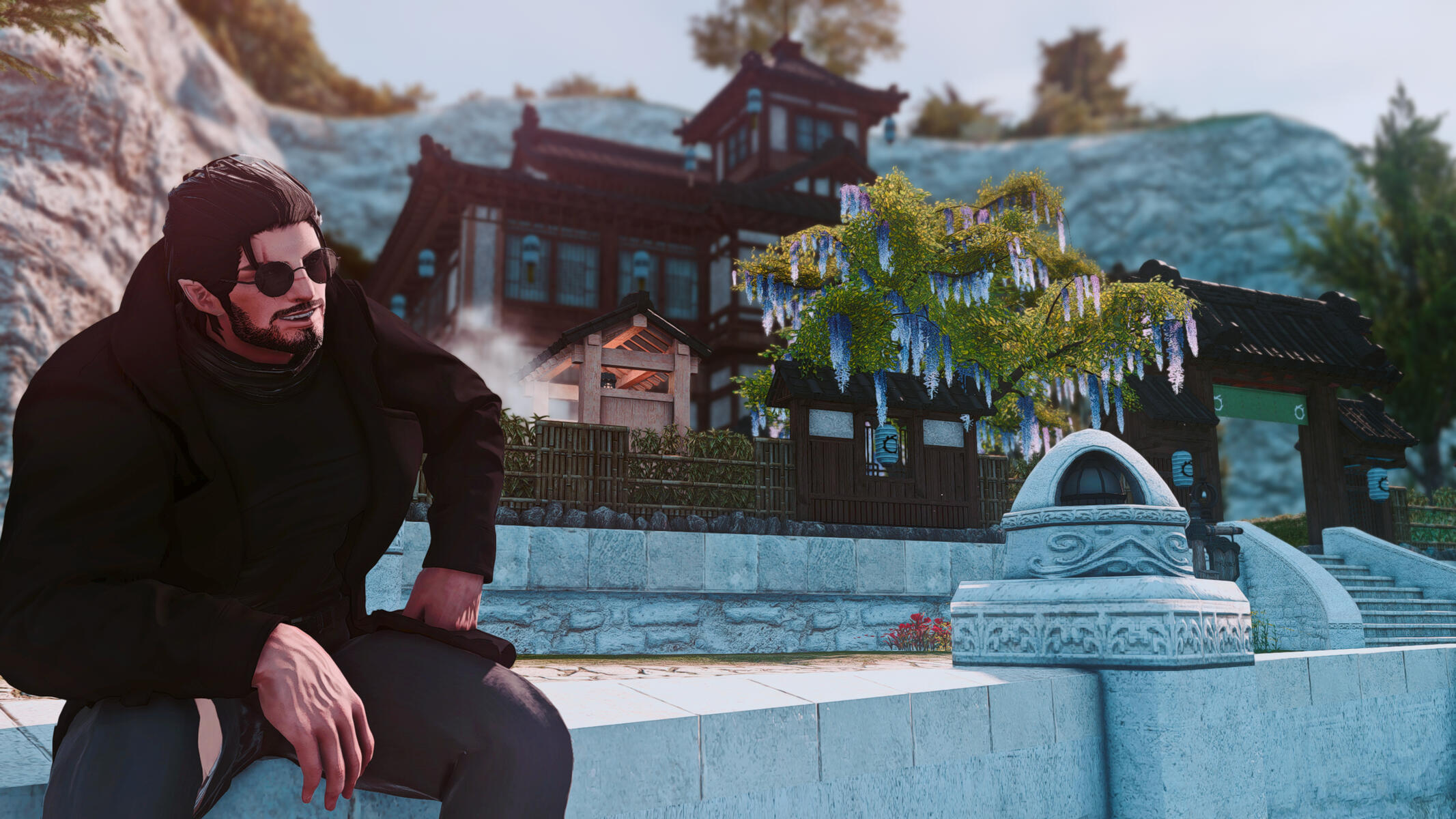 Tyr Sitting in front of the large house him his free company built together. Proud of His Accomplishments.